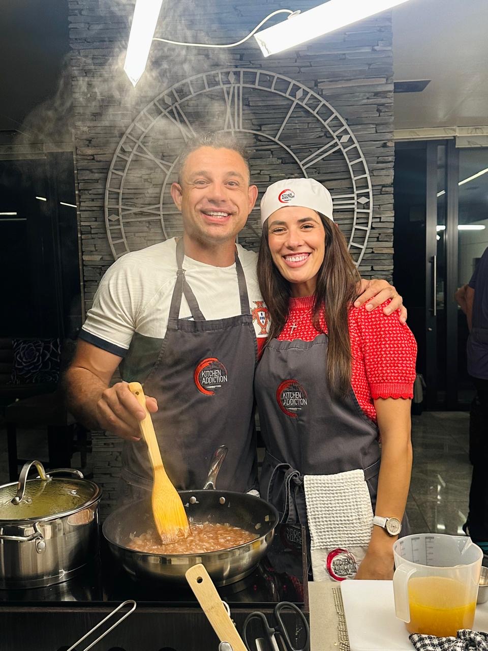Guests cooking at a Kitchen Addiction class